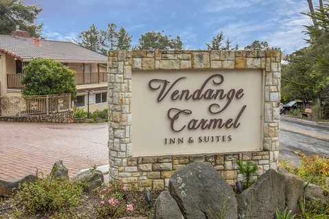 Sign and entrance of Vendange Carmel Inn & Suites in Carmel, CA